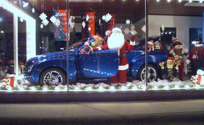 This window display may suggest a good present for Christmas, a gorgeous blue car accompanied by Santa.