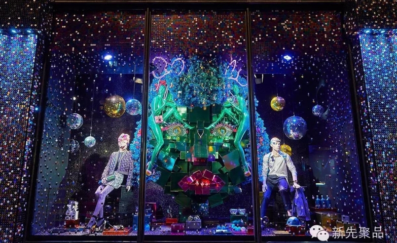Another Harvey Nichols Christmas window display, decorated with blue lights, disco balls, and many presents.