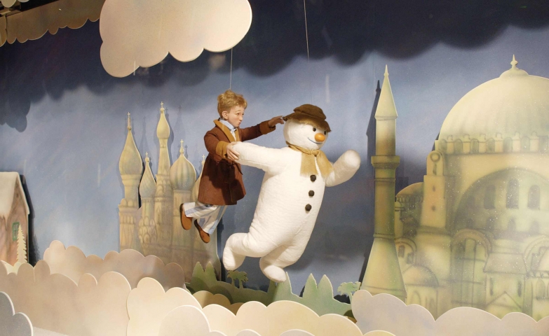 It may be a child's dream, following through clouds a snowman, but it's just a Christmas window display.